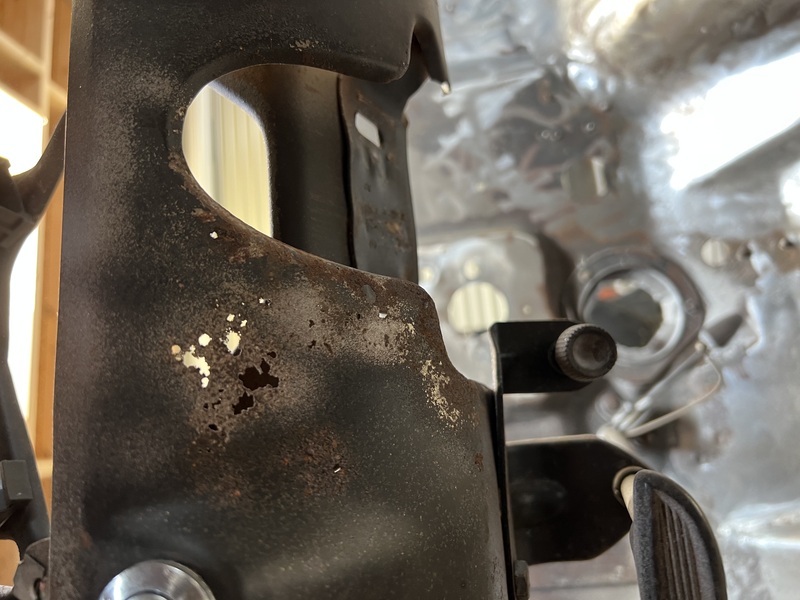 Rust holes in dash around steering column.